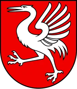 Blason rouge avec une Grue blanche, les ailes déployées.