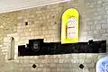 La litre funéraire sur le mur sud de l'église.