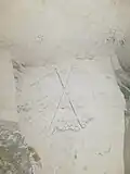 Drapeaux français et américain entrecroisés et surmontés d'une étoile.