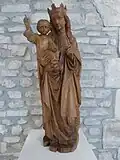 Vierge à l'enfant en bois naturel. XVIe&nbsp;siècle. Provenant de l'église Saint-Martin de Charmes.
