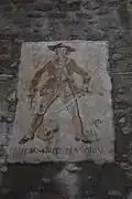 Sculpture sur la porte de la Ganivelle jouxtant la maison de Mandrin.
