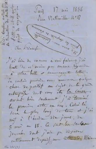 Lettre manuscrite sur papier bleu.