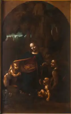 Tableau en couleur. Dans un cadre de rochers, une femme est entourée de deux bébés nus. L'un est agenouillé l'autre est assis. Un personnage habillé et ailé regarde l'observateur.