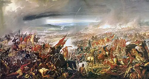 Peinture en couleurs. La scène représente une mêlée intense entre soldats sur un champ de bataille chaotique. Au centre, un cavalier brandit son épée, entouré de corps blessés ou morts. Le ciel est chargé de fumée et de poussière, mais laisse une éclaircie de forme elliptique au-dessus du cavalier central.