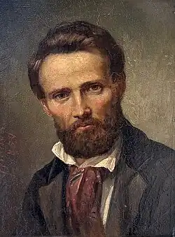 Photographie d'une peinture où est représenté un homme barbu en demi-buste portant une veste type blazer, une chemise blanche et un foulard comme cravate, qui fixe le spectateur de son regard.