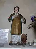 Statue de Saint-Goussaud et de son veau piqué d'épingles.