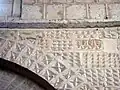Motifs géométriques sur les écoinçons des arcades de la nef.