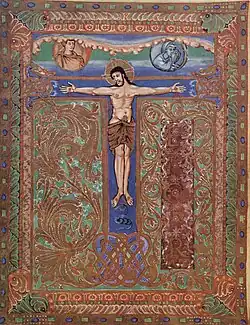 Folio 6v, page du Te igitur, le T reprenant la croix de la Crucifixion[v 2]