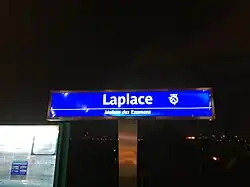 Autre panneau de la gare, avec le sous-titre Maison des Examens.
