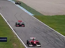 Photographie de Fernando Alonso, Jenson Button et Sebastian Vettel au Grand Prix d'Allemagne