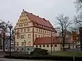 Ansicht von Südwest mit rückwärtiger Fassade und Anbau