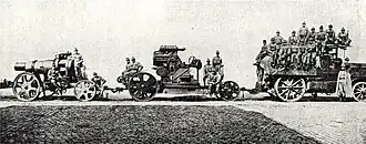 Австро-Даймлер М12 буксирует М11 с расчётом, на двух прицепах, 1914 год.